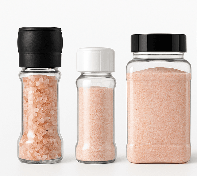 Retail trio of a coarse-salt grinder, a fine-salt shaker, and a clear PET jar of pink Himalayan salt.